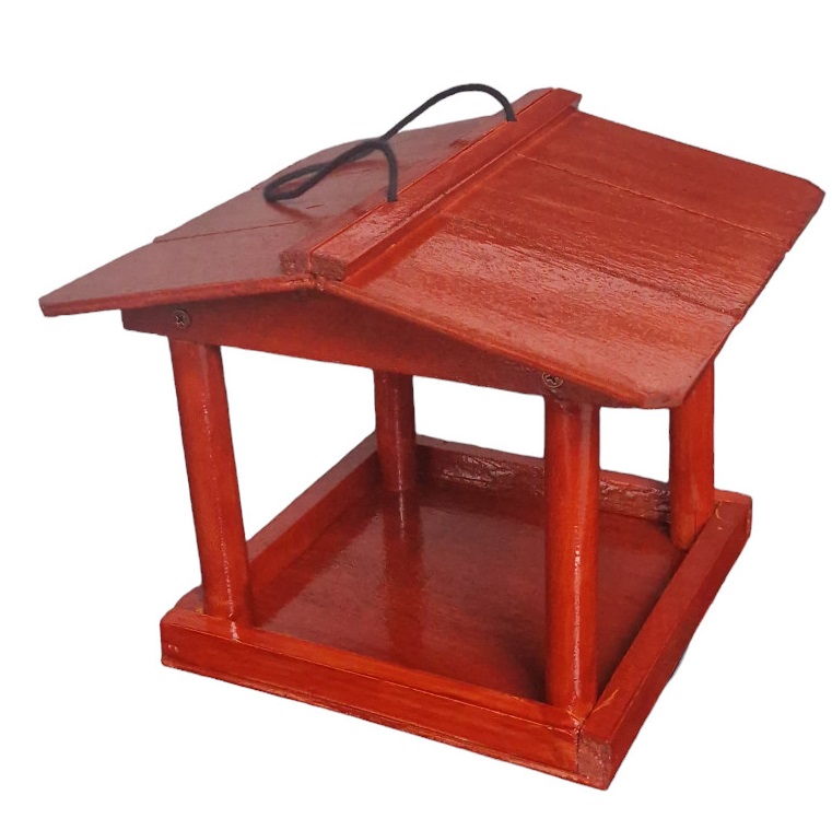 A red wooden bird feeder with a covered roof and hanging cord.
