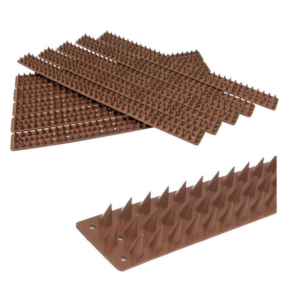 Brown plastic prickle spikes for fence and wall deterrent, arranged in overlapping layers.
