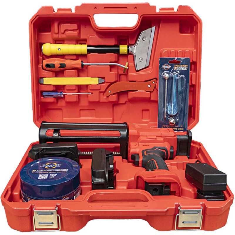 Open red case containing the Joint It Electric Battery Epoxy Grout Application Gun Pro Kit with tools and accessories.