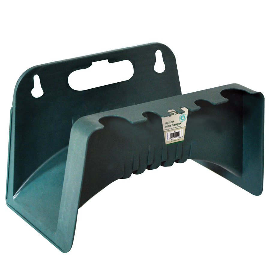 Wall-mounted garden hose pipe hanger in dark green with a label attached.