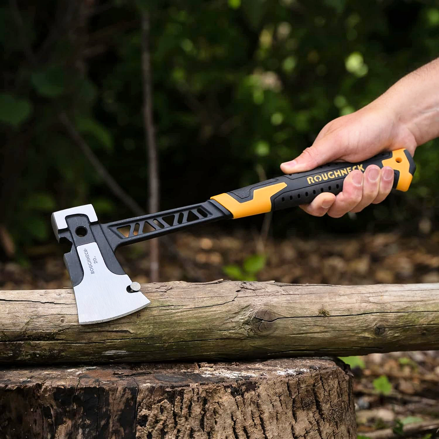 Person using Roughneck Gorilla V Series Utility Hand Axe to cut a log outdoors.