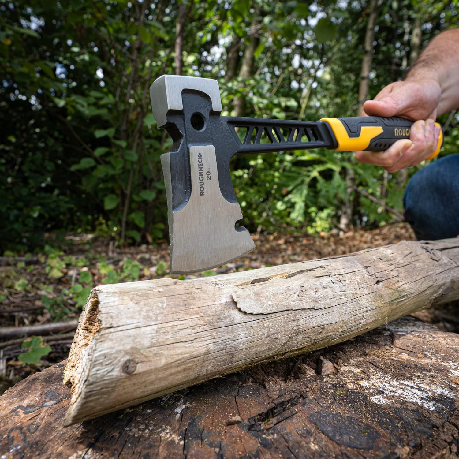 Person using a Roughneck Gorilla V Series Utility Hand Axe to chop a log outdoors.