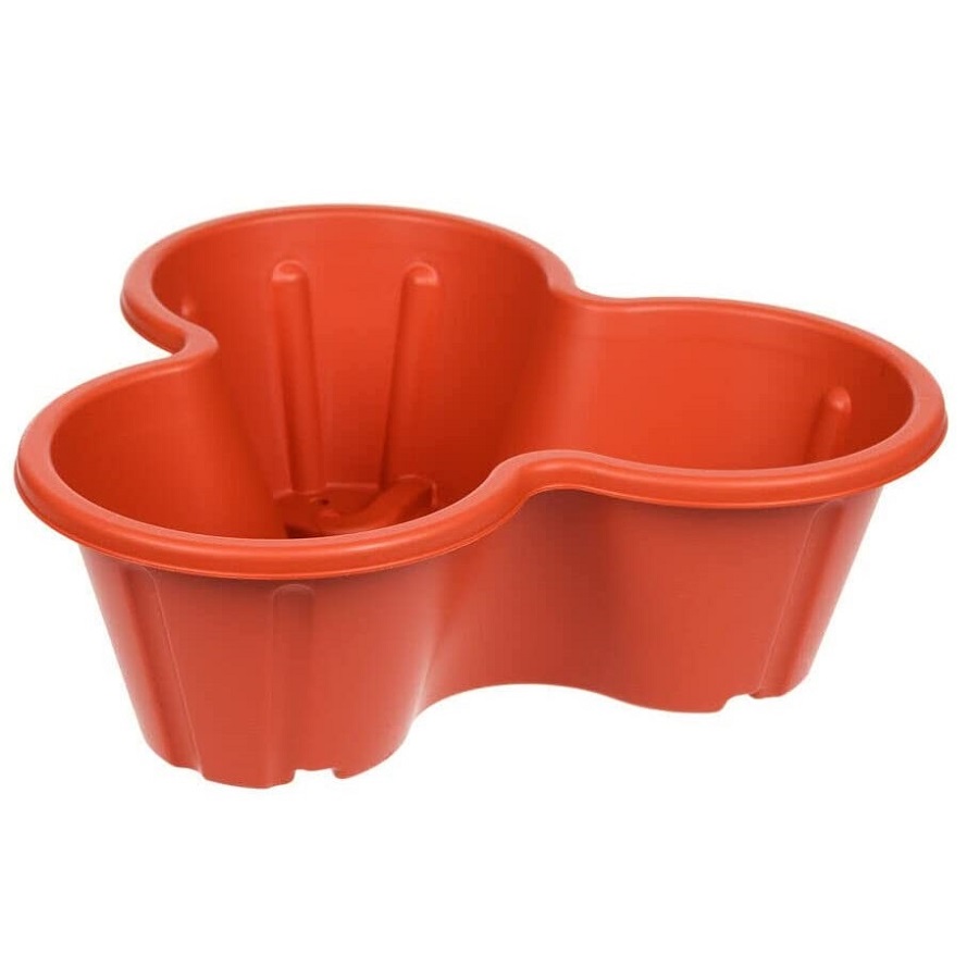 Terracotta stackable planter pot with three sections for planting.
