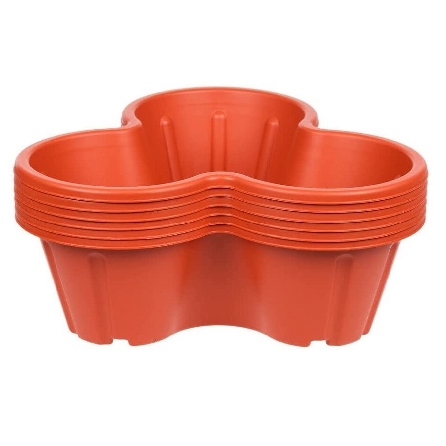 Stack of terracotta planter pots with a strawberry and flower design.