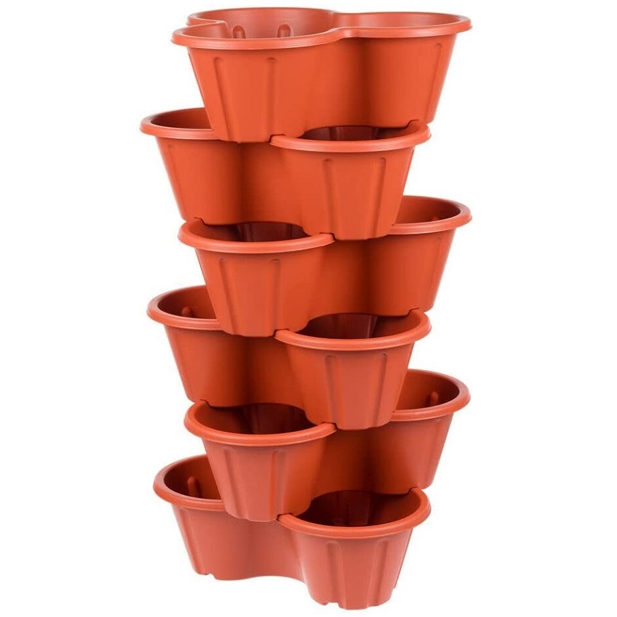 Stacked terracotta planter pots for strawberries and flowers.