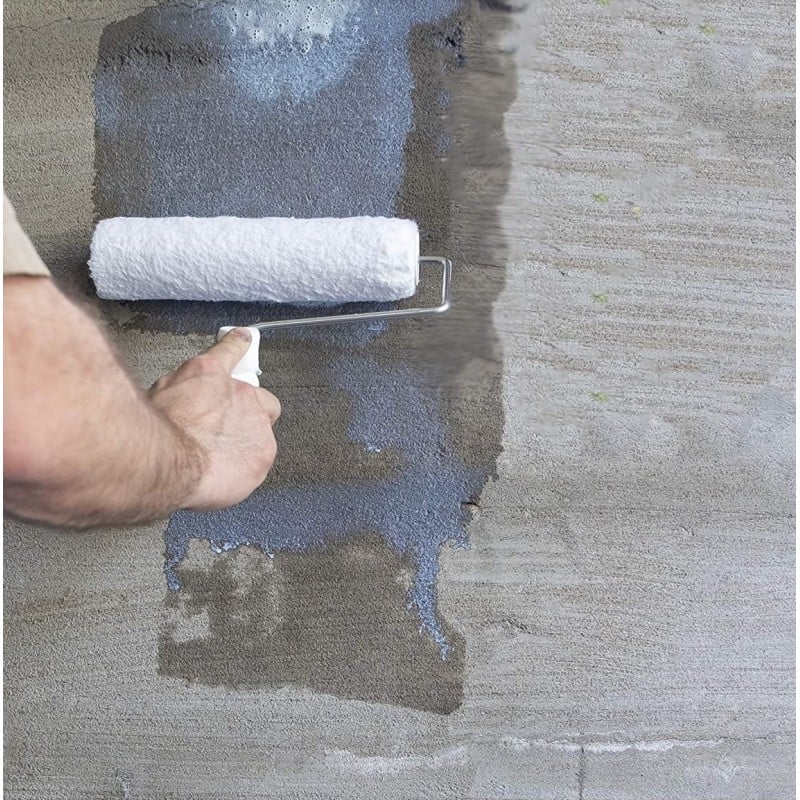 Person applying a liquid sealer with a roller on a concrete surface.