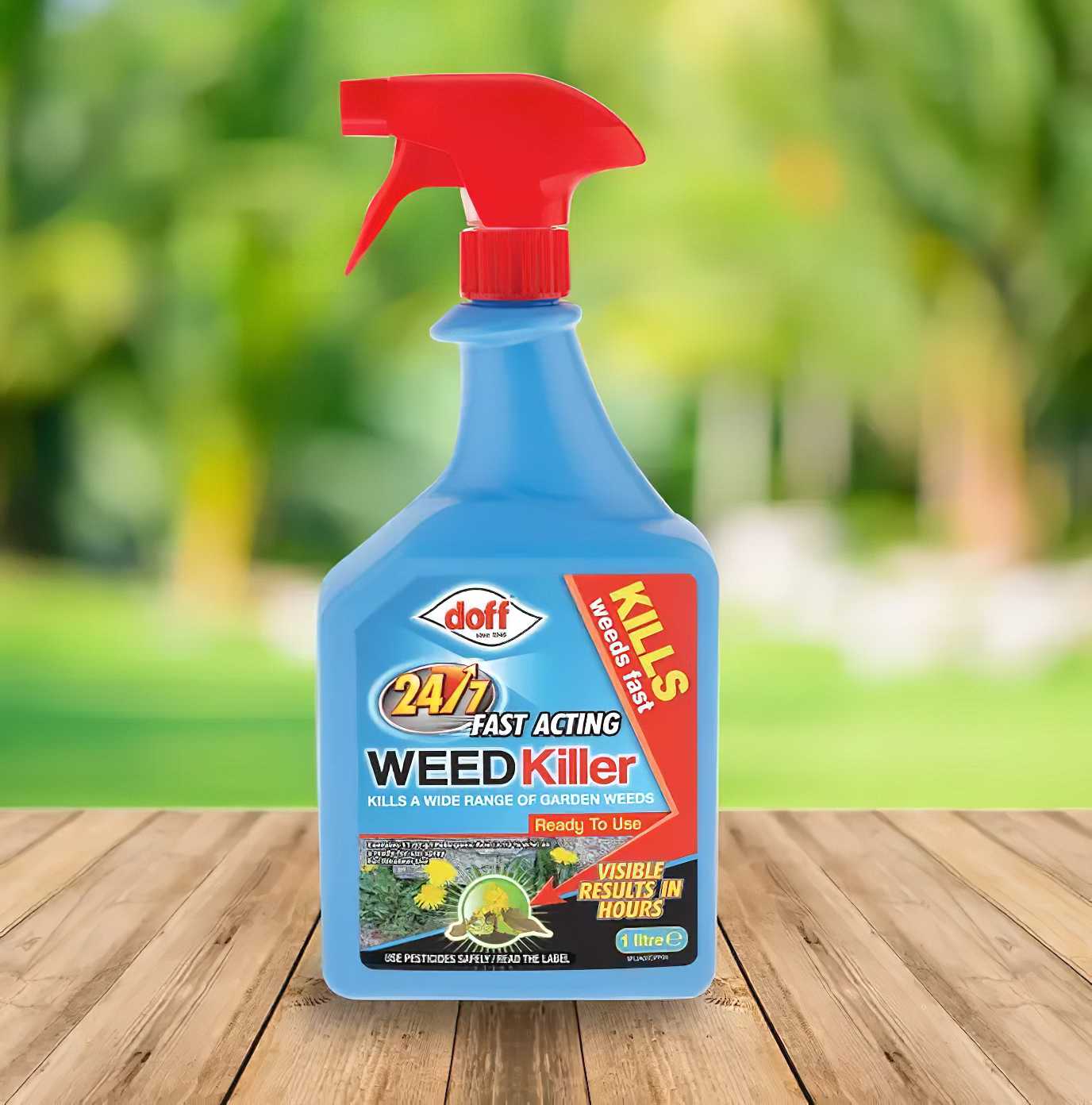 Doff 24/7 Superfast Weed Killer bottle on a wooden table with a blurred green garden background.