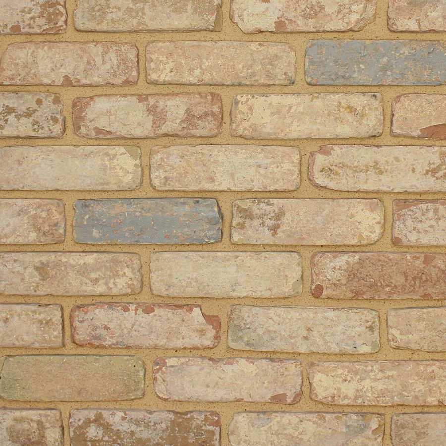 Close-up of multi-shade brick wall with pale buff mortar for a traditional finish