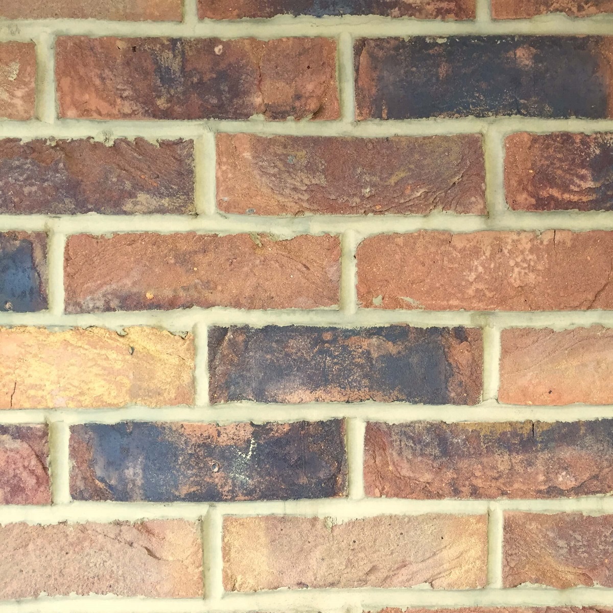 Warm-toned brick wall featuring marigold-tinted mortar from Everbuild’s powder colour range