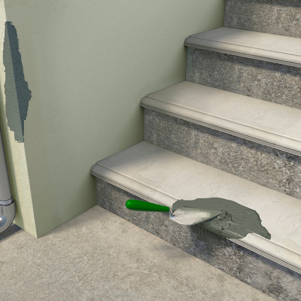 Application of patch repair mortar on concrete stairs and wall.