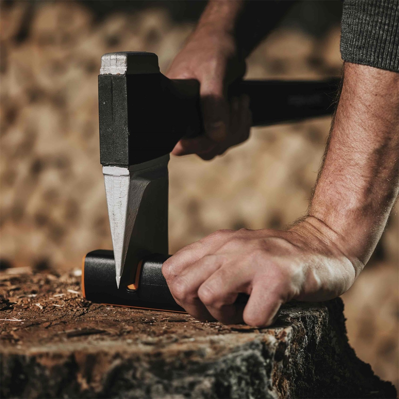 Fiskars knife sharpener with black and orange sharpening a fiskars axe