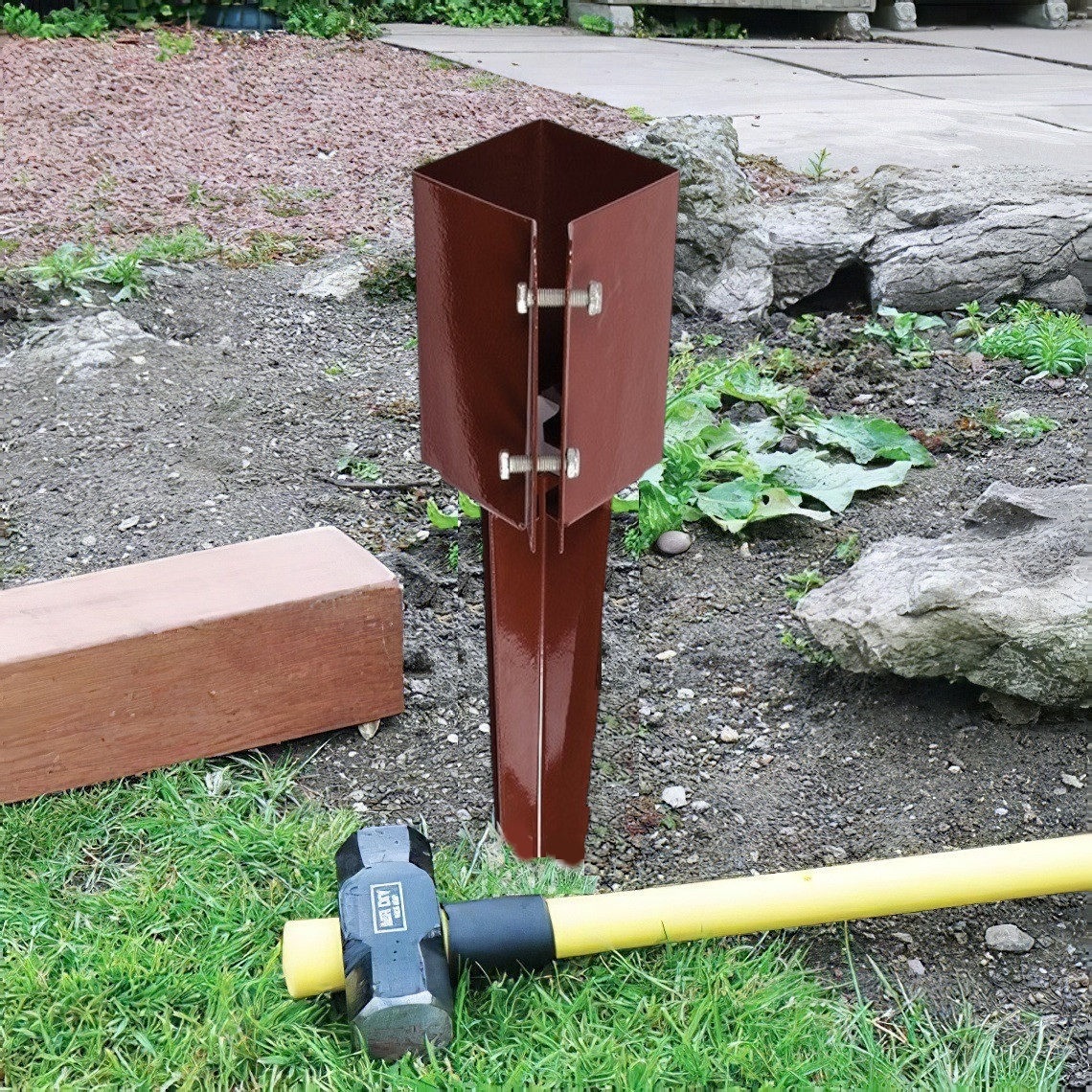 Brown metal post spike for timber clamping fence with bolts in use