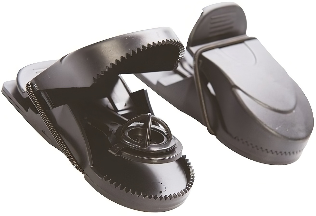 Black plastic rat trap with a spring-loaded mechanism and serrated edges, designed for quick use.