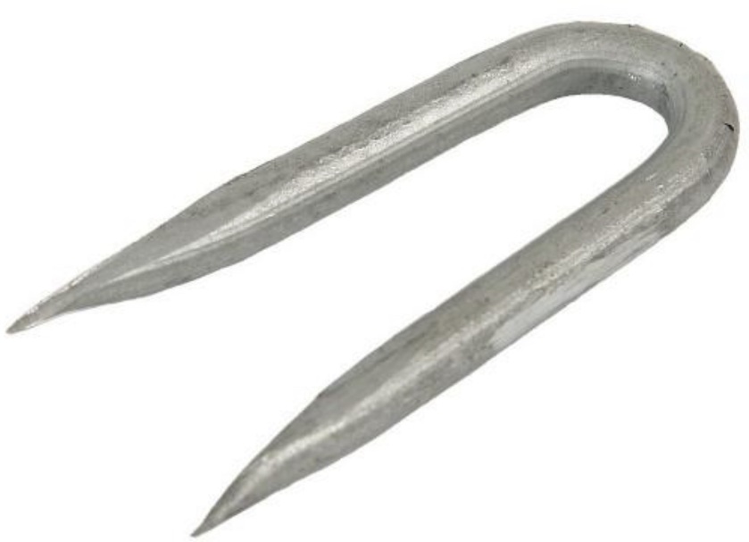 A collection of galvanised U-shaped netting staples, 15mm in size.