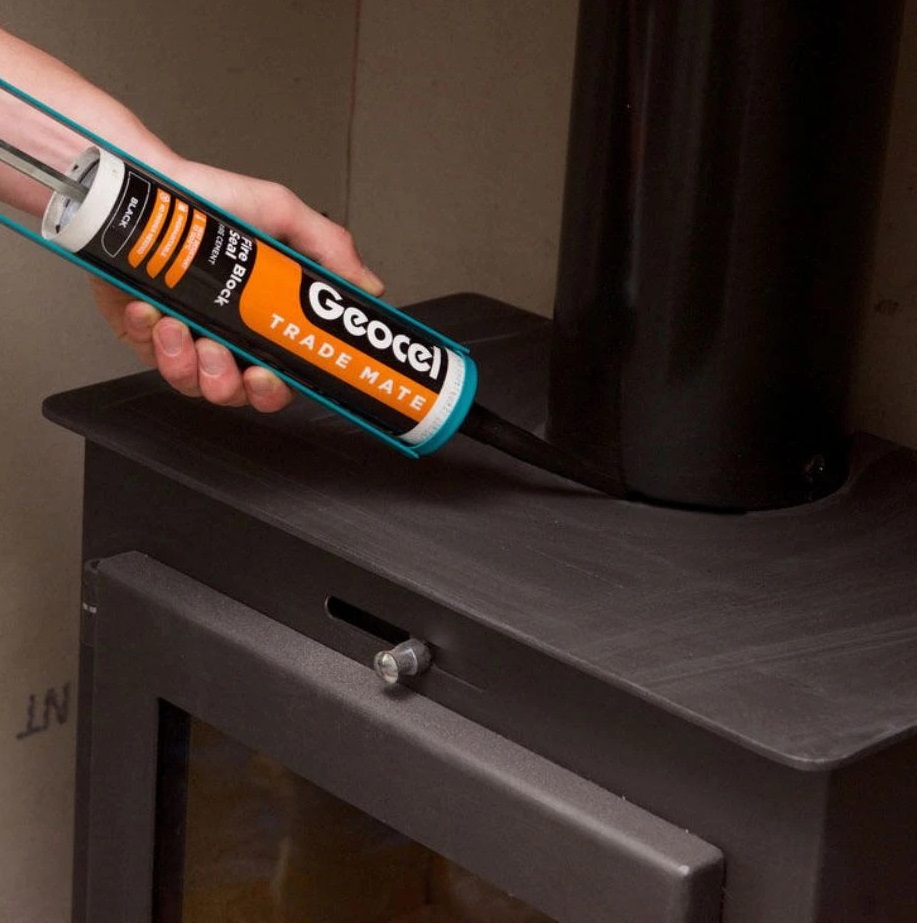 Applying sealant around a stove pipe with Geocel Trade Mate