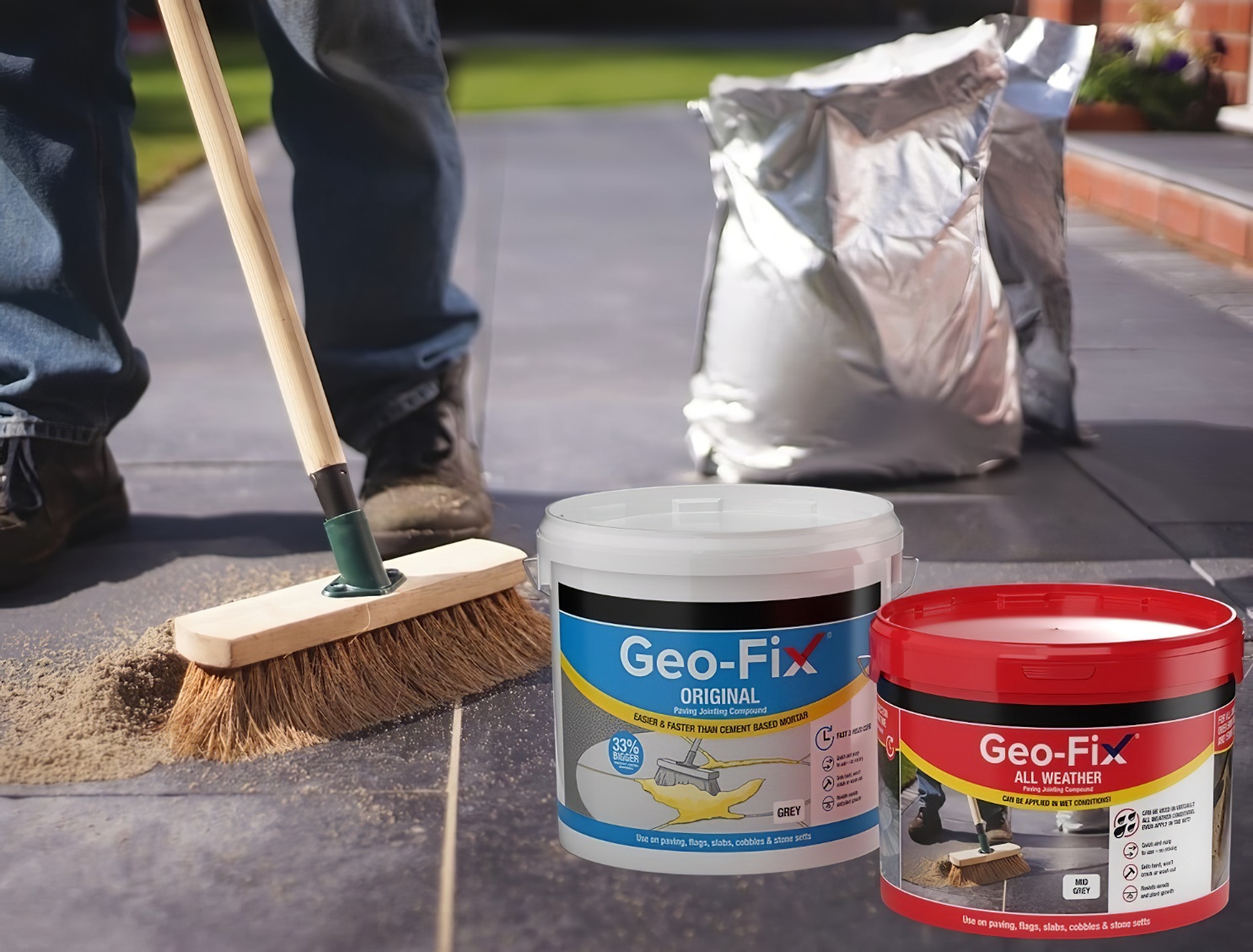 Person sweeping paving slabs with Geo-Fix jointing compound containers in view
