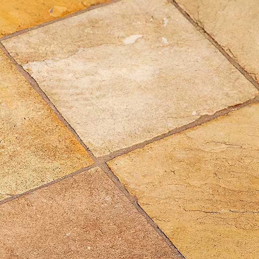 Close-up of high-gloss stone tiles with a sealed finish.