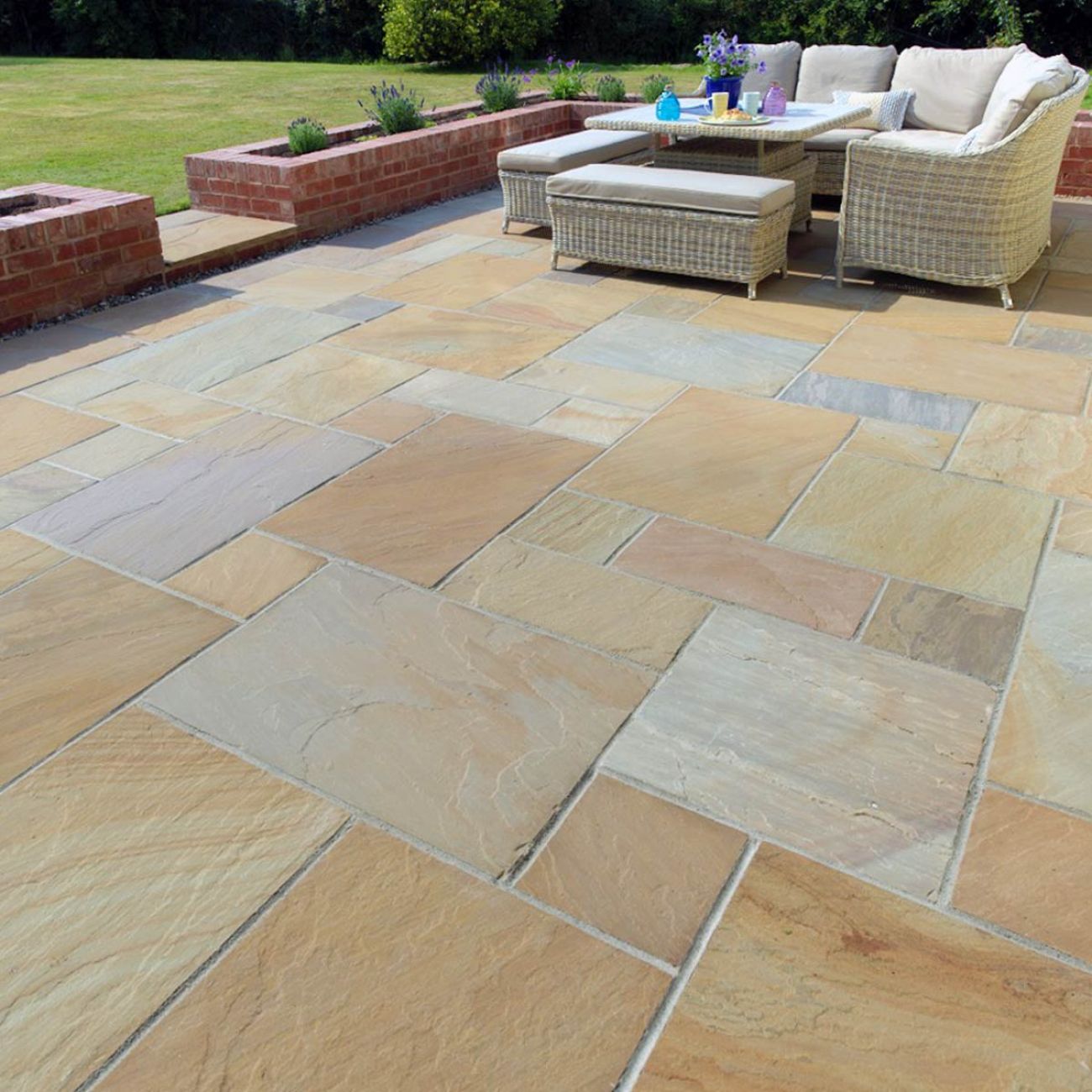 Patio area with neatly arranged paving stones and outdoor furniture.