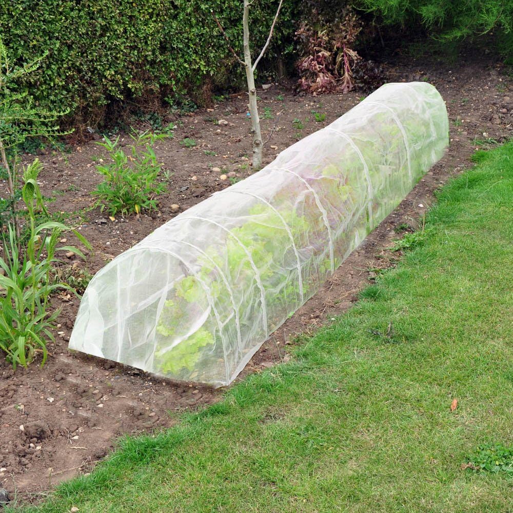 A 3m traditional fleece grow tunnel in a garden, used for frost protection over plants.