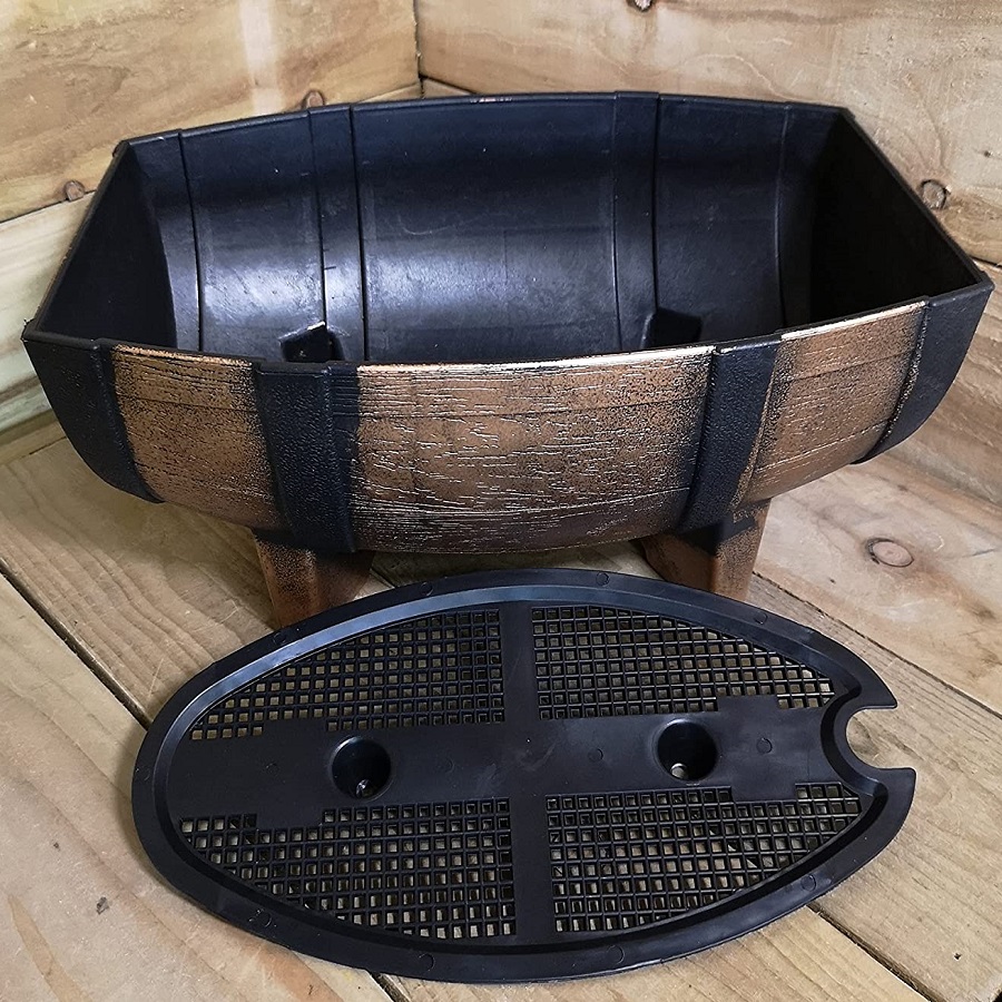Wood effect half barrel plastic planter trough with drainage base on wooden surface.
