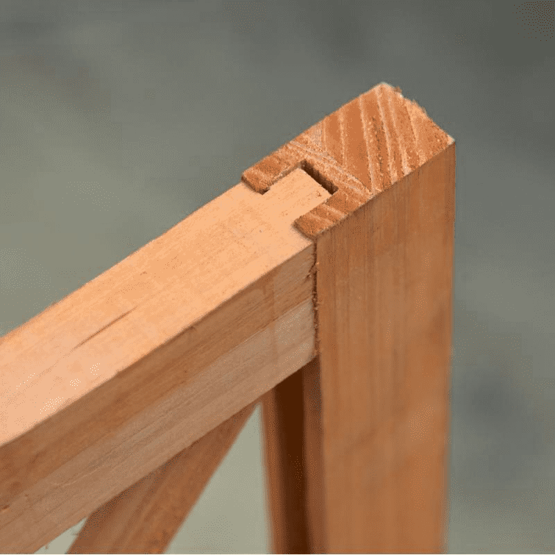 Close-up of a wooden joint on a garden trellis.