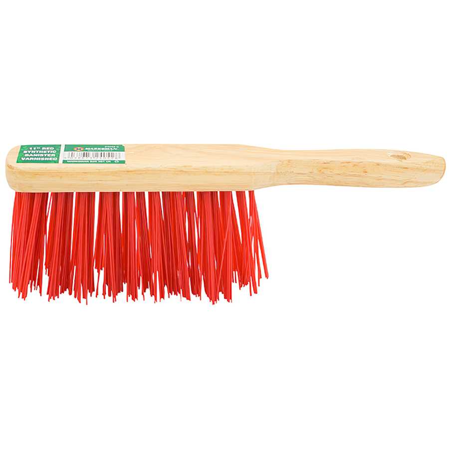 Wooden hand brush with stiff red synthetic bristles.