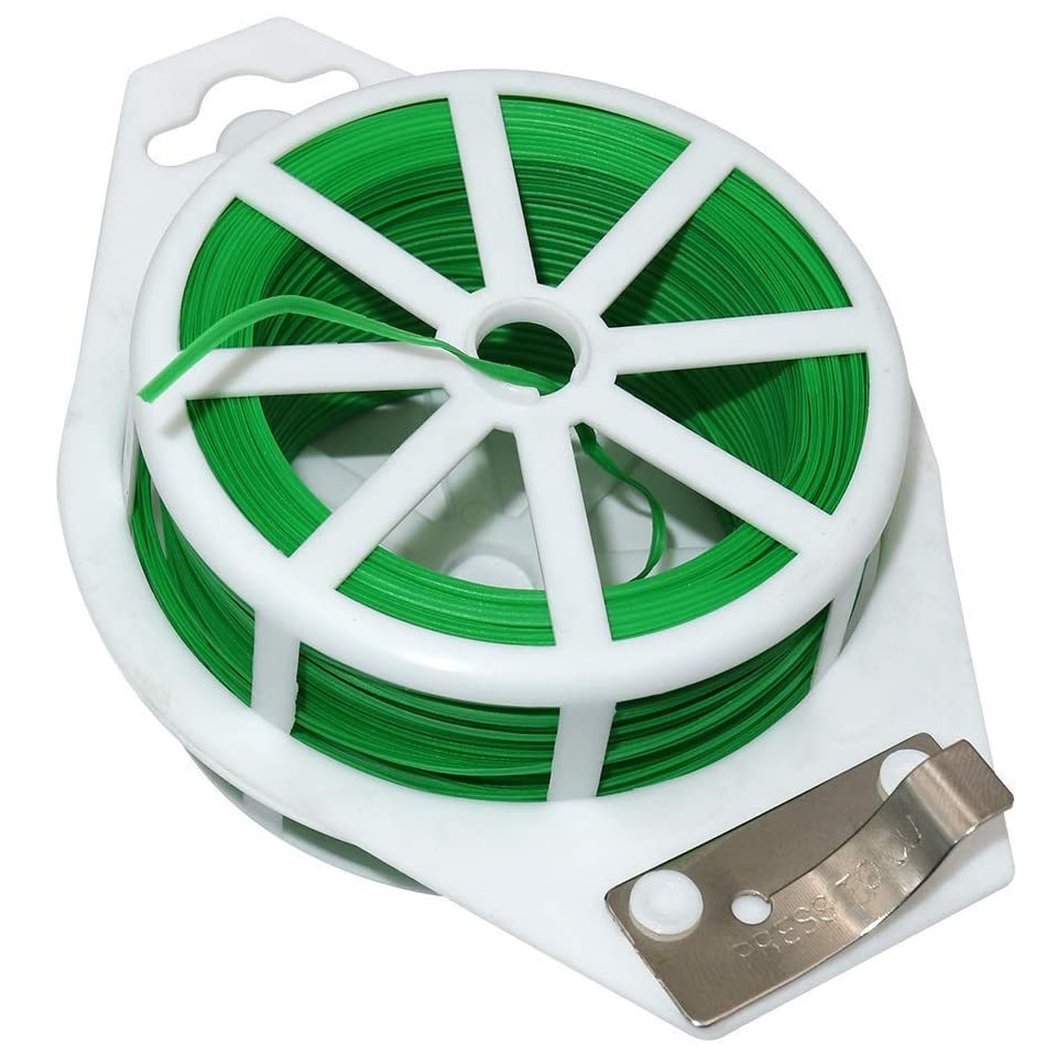 Green tie wire spool with cutter for plant support.