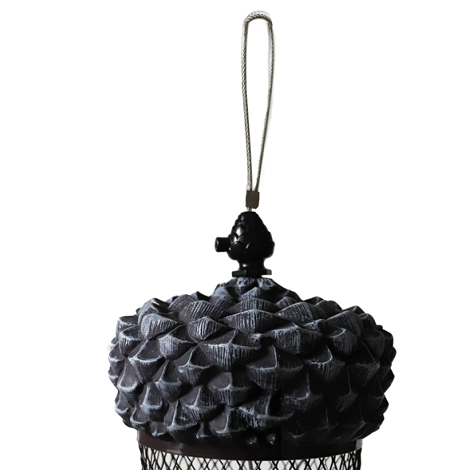 Close-up of a wild bird feeder with an acorn-shaped top and mesh body for holding seeds.
