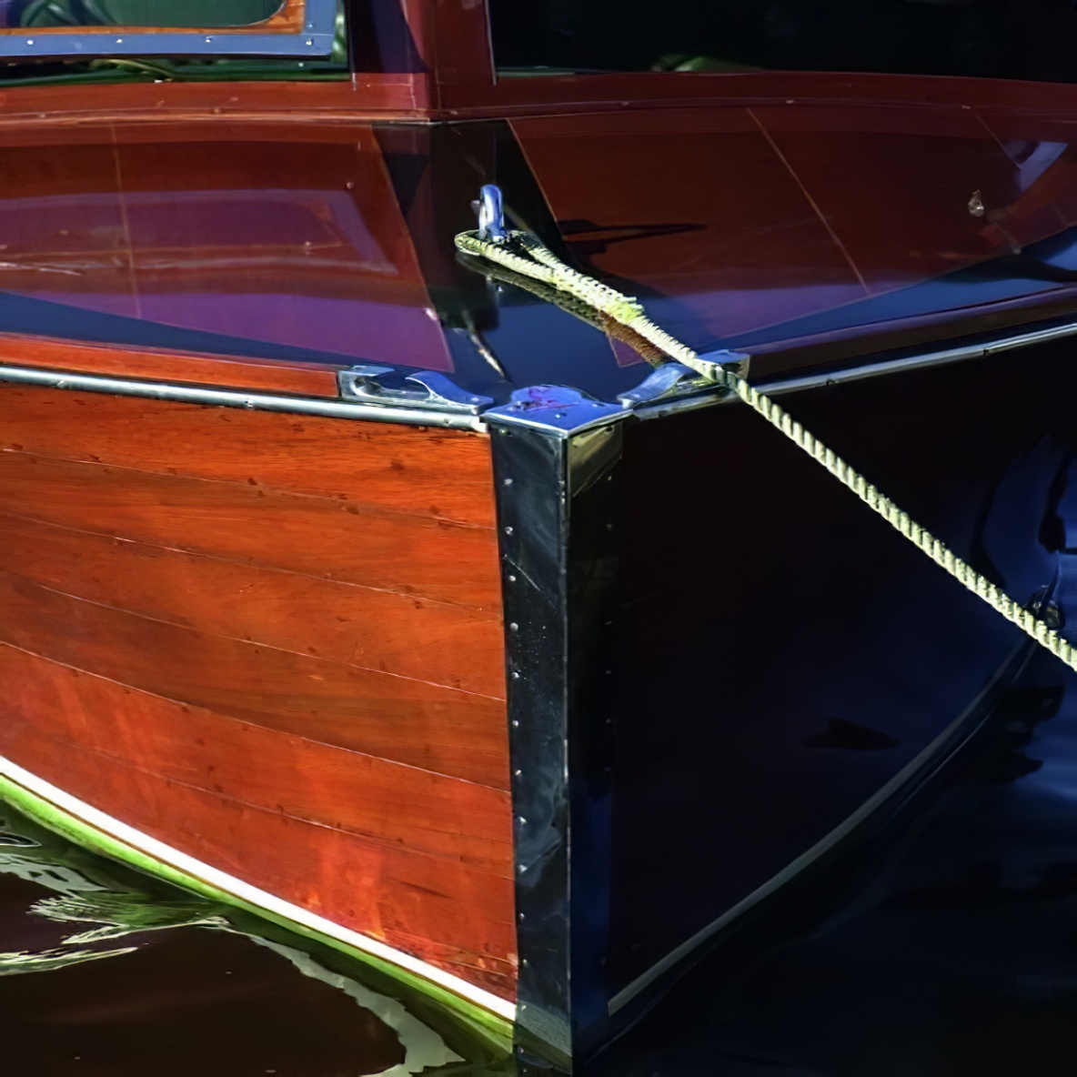 Close-up of a yacht with a high gloss wood finish on the hull.