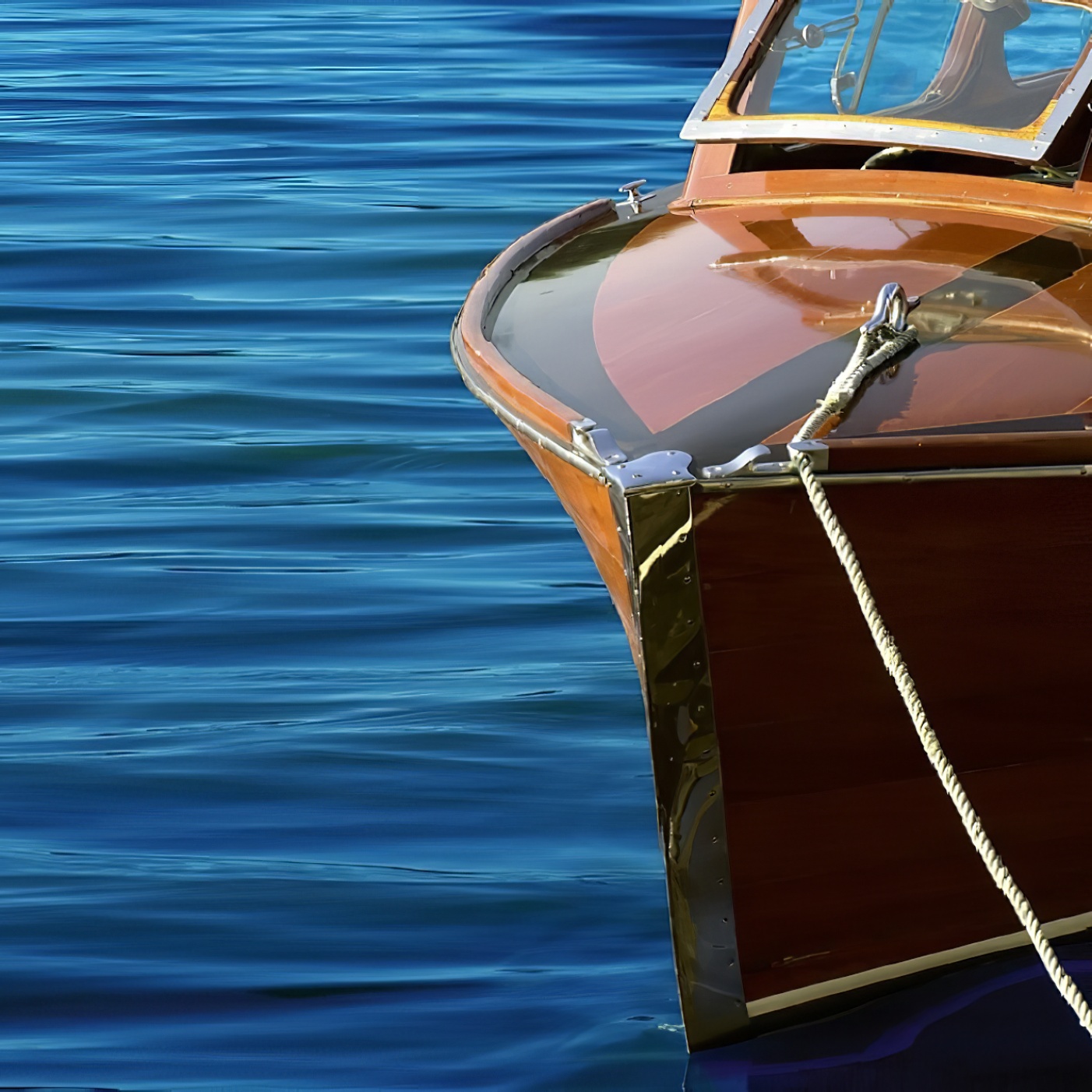 Close-up of a yacht with high gloss wood finish on a sunny day.