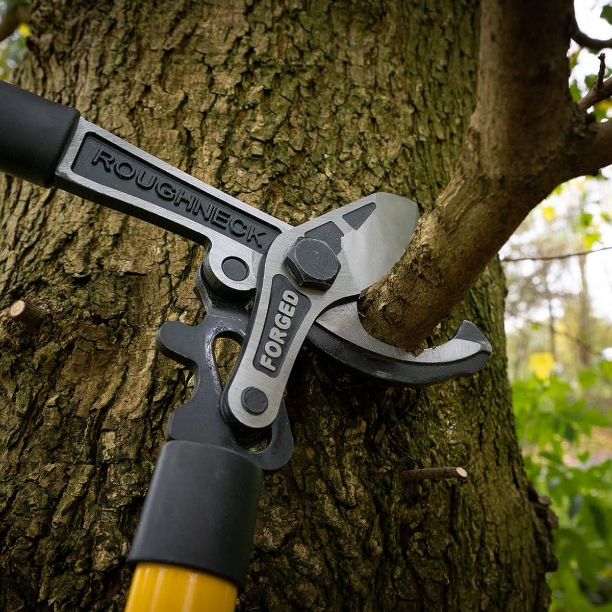 Roughneck XT PRO Heavy Duty Garden Bypass Lopping Shears cutting a tree branch.