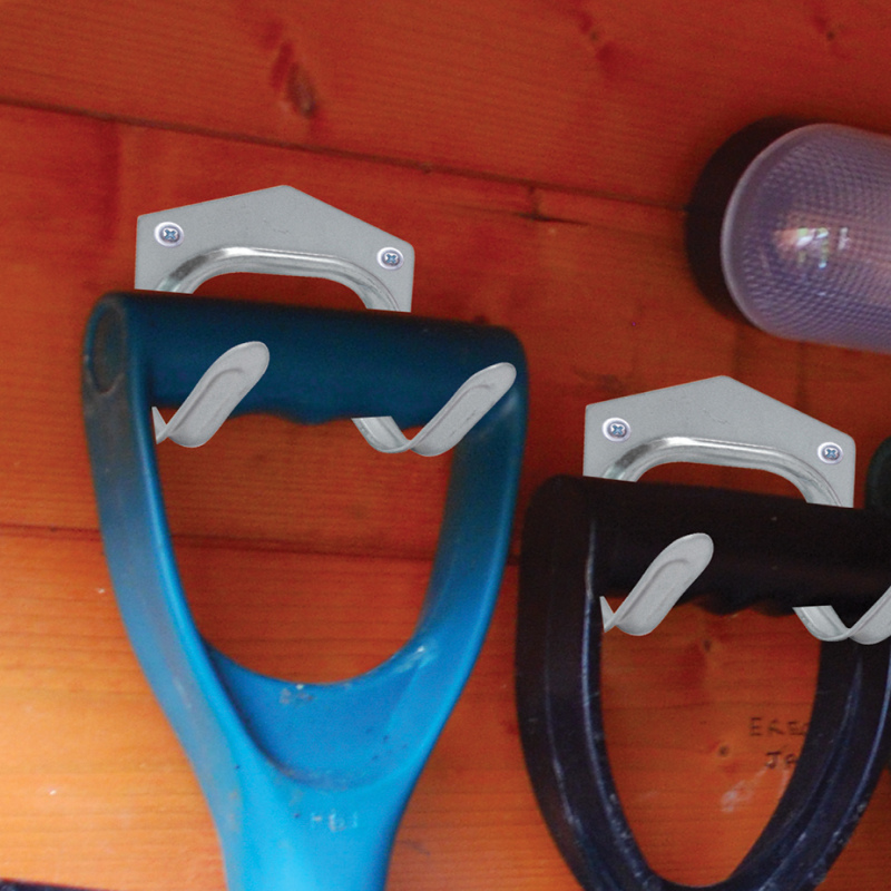 Galvanised garden tool wall storage hooks holding tools in a wooden shed.