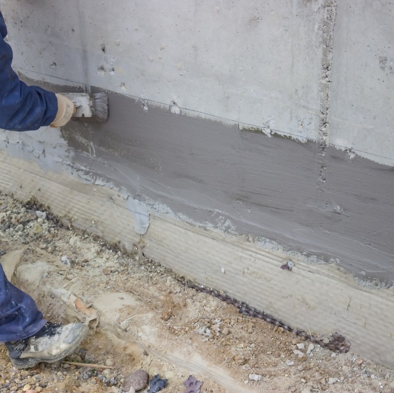 Application of Sika Damp Proof Slurry on a concrete wall for water resistance