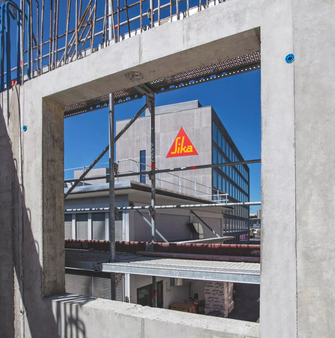 Concrete formwork with a view of the Sika building in the background.