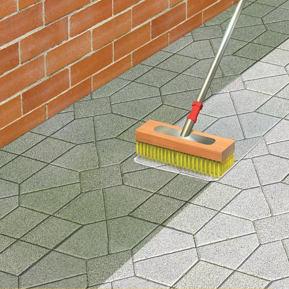 Application of clear paving sealer on patio with brush