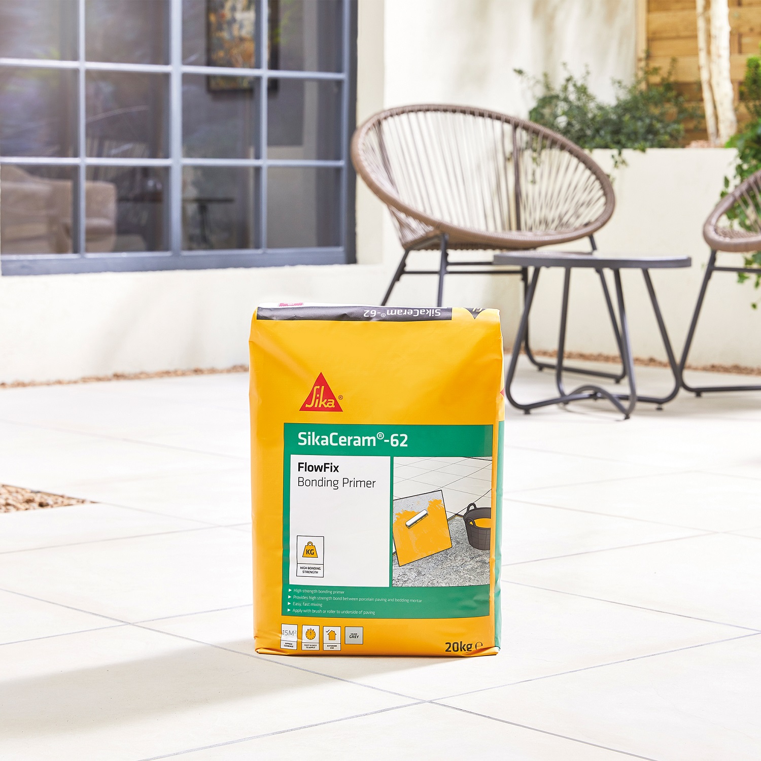 Bag of Sika Sikaceram 62 Porcelain Flowfix Bonding Slurry Primer for Paving on a tiled patio.