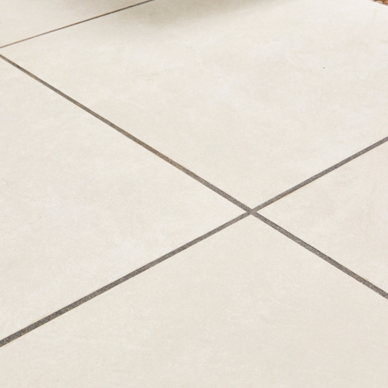 Ivory porcelain paving with visible jointing lines.