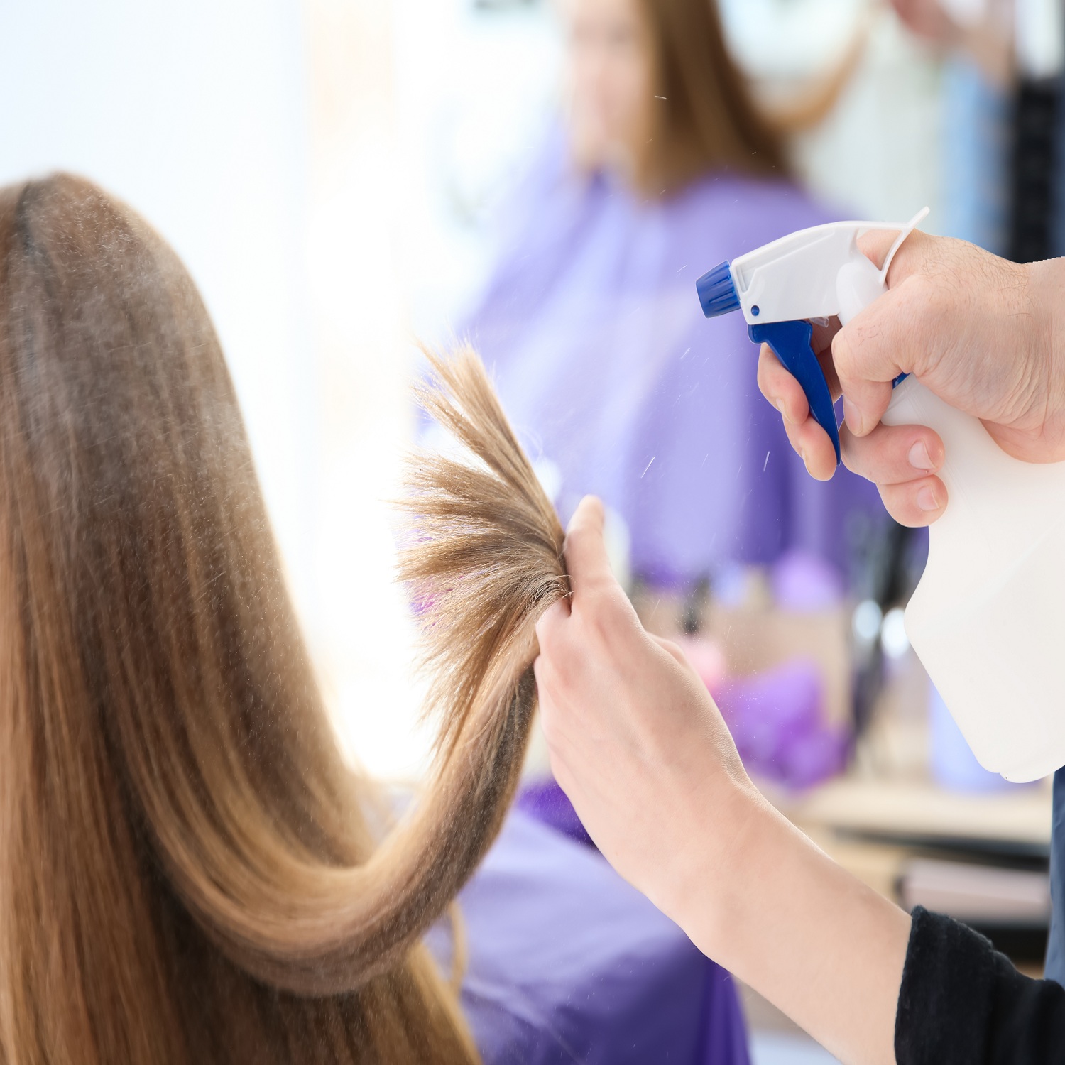 Professional hairdresser working with client in salon Professional hairdresser working with client in salon
