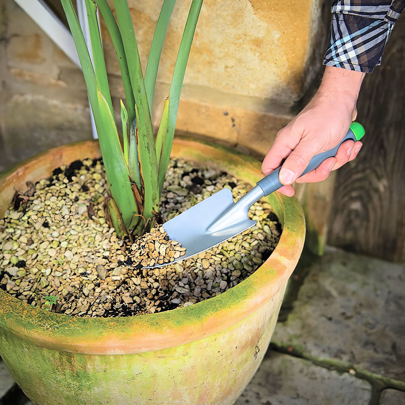 Silverline garden hand trowel with a grey handle and silver blade, designed for soil cultivating and planting in-use