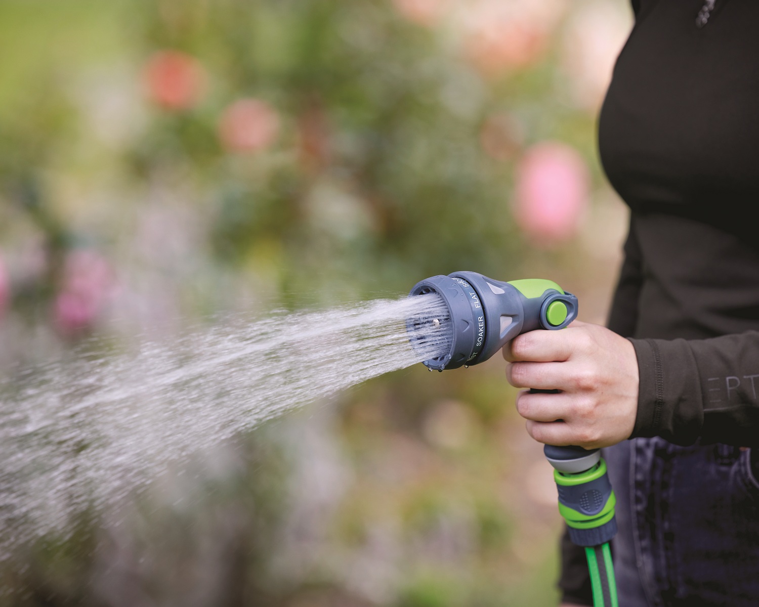 Green and grey garden hose spray water gun with connectors soaker spray pattern