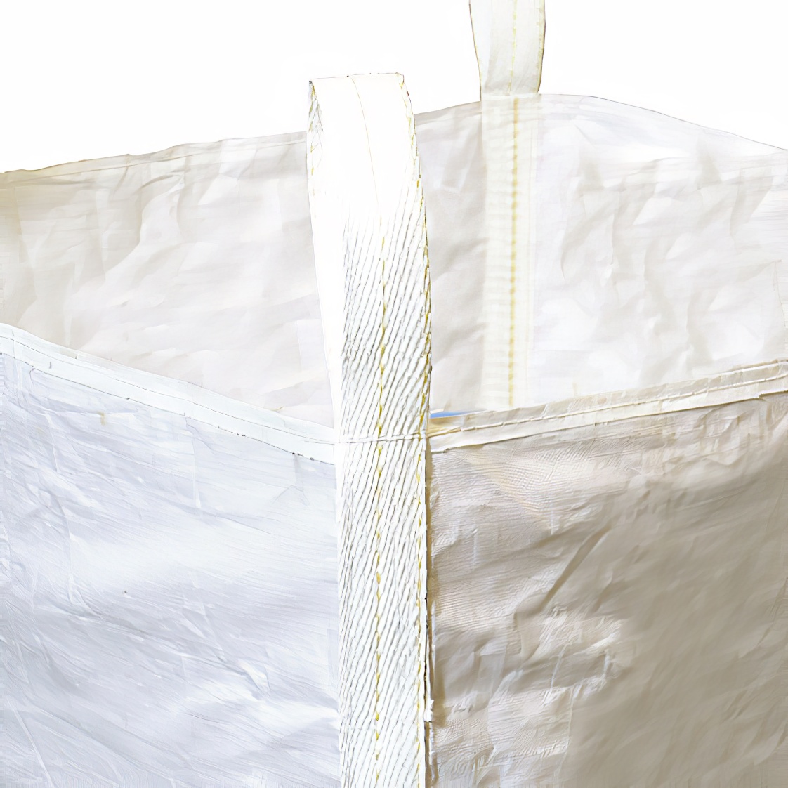 A large white dumpy bag filled with material, featuring sturdy loop handles for easy forklift lifting.