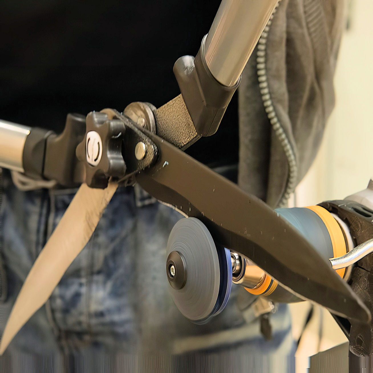 Person using a Silverline Lawn Mower Blade and Tool Sharpener to sharpen a tool edge.