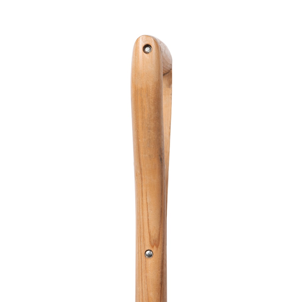 Close-up of the wooden handle of a garden spade with visible screws.