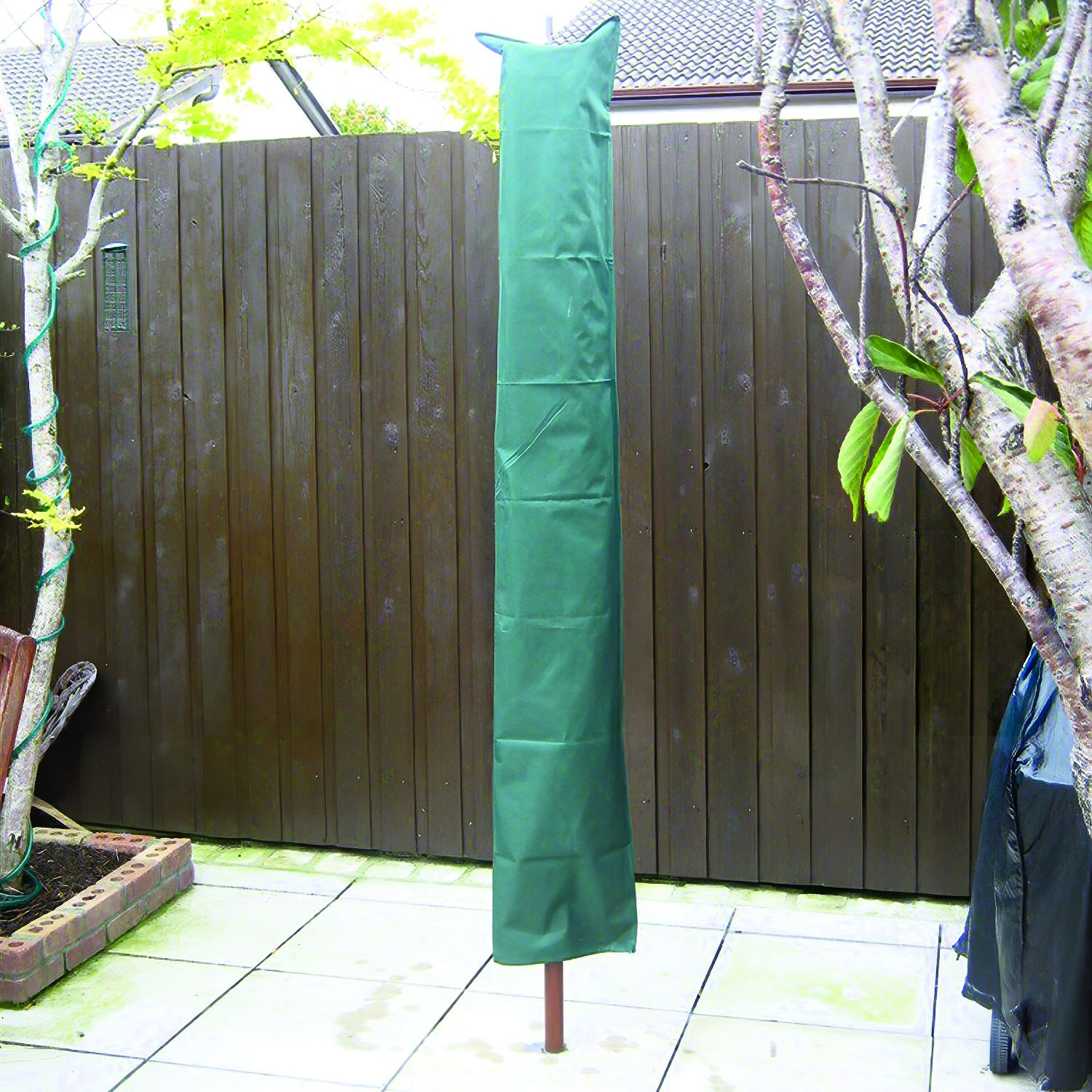 Green protective cover for a rotary clothes line demonstration winter time