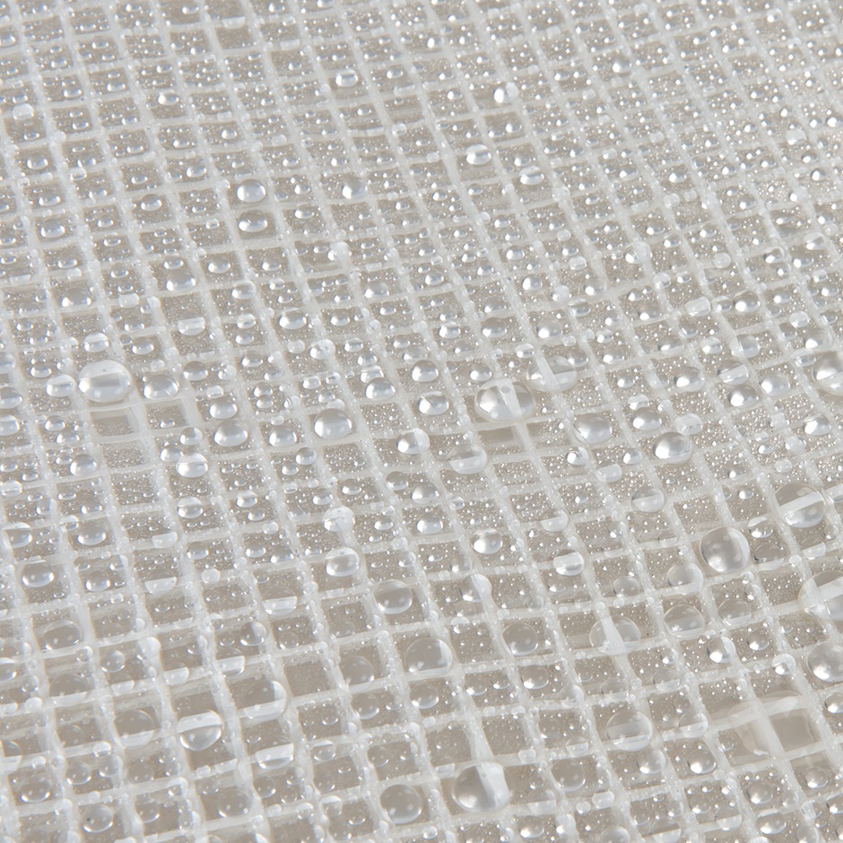 Folded transparent tarpaulin with reinforced edges and eyelets.