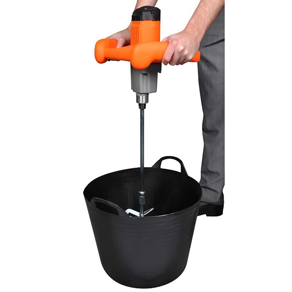 Person using an orange Vitrex Electric Power Mixer to mix plaster in a black bucket.