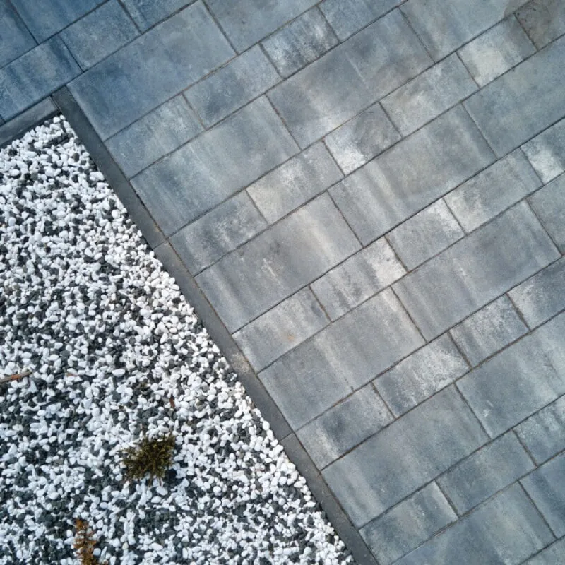 Aerial view of a garden with white pebbles and grey paving stones