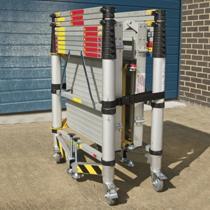 Folded Zarges Teletower Aluminium Telescopic Scaffold Tower with wheels on a concrete surface.