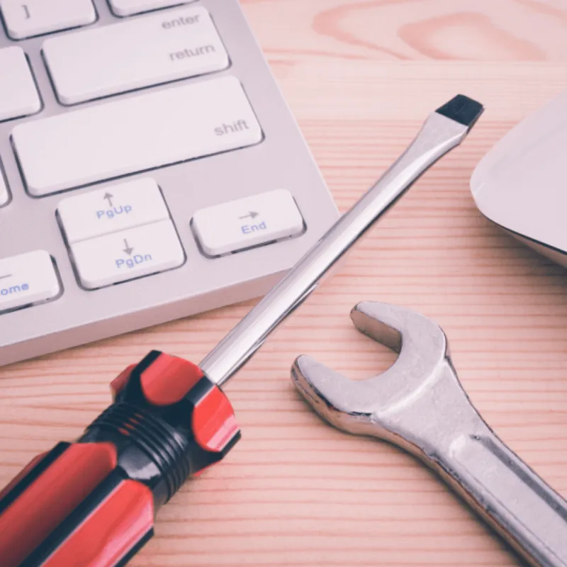 Tools alongside computer accessories on a desk Troubleshooting Common Issues