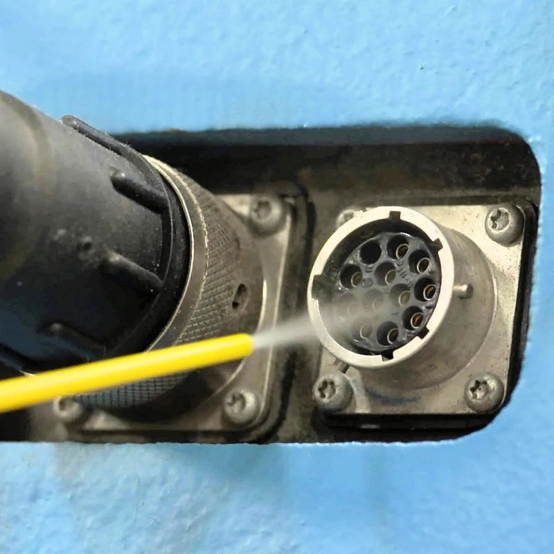Close-up of WD40 Specialist Fast Drying Electrical Contact Cleaner being applied to an electrical connector.
